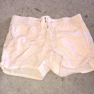 Light pink cargo shorts.